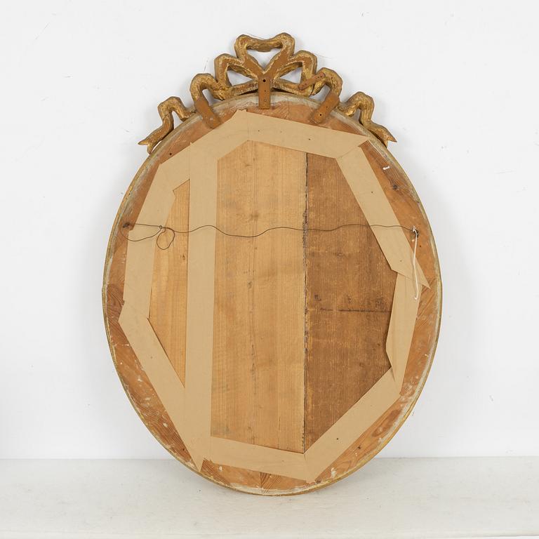 A gustavian style mirror, beginning of the 20th century.