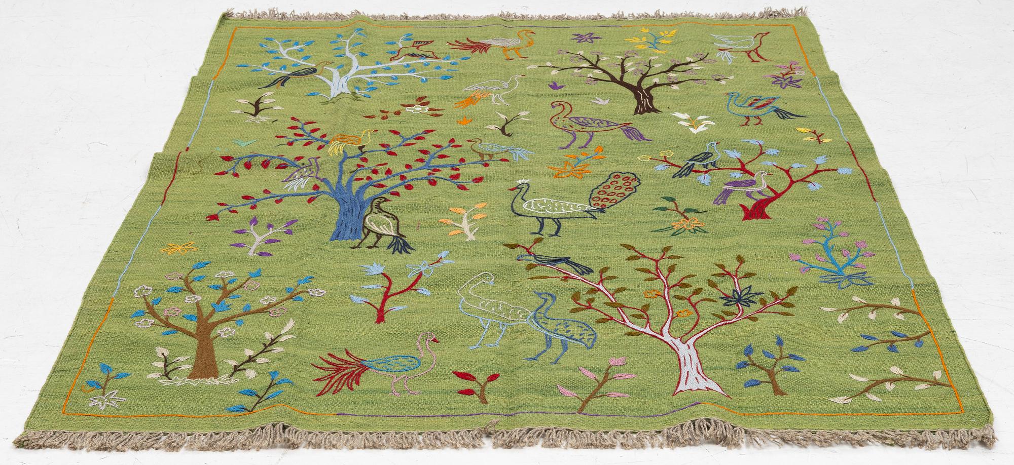 A hand-embroidered Kilim rug, c. 200 x 150 cm.