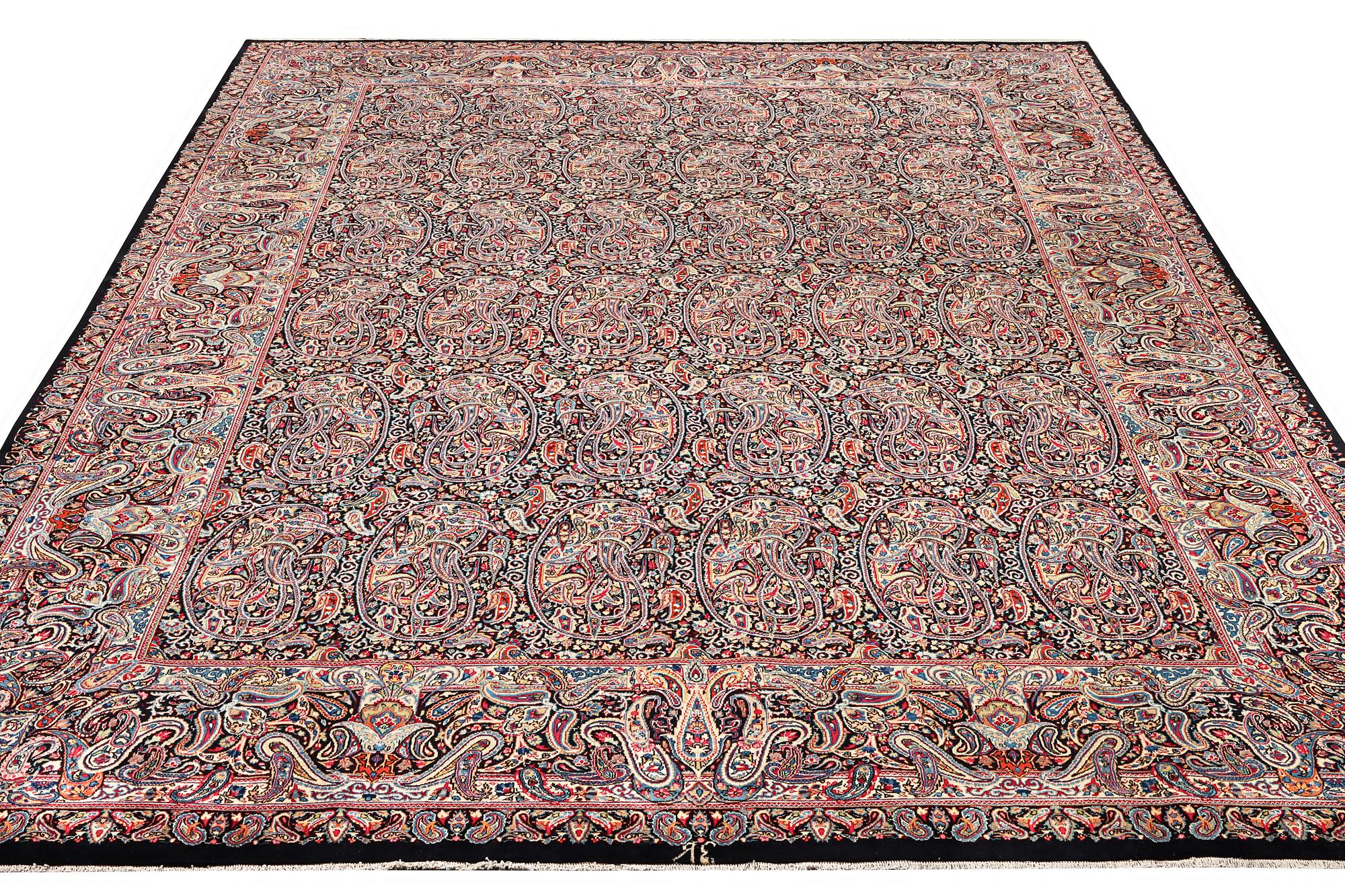 A Boteh pattern Kerman carpet, c. 475 x 342 cm.