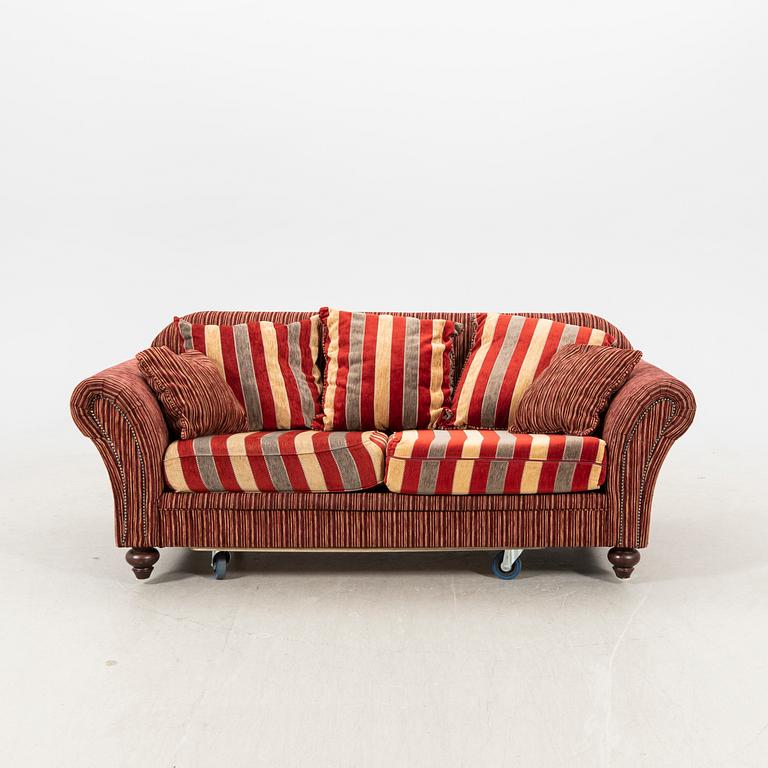 A sofa,with pillows. later part of the 20th Century.