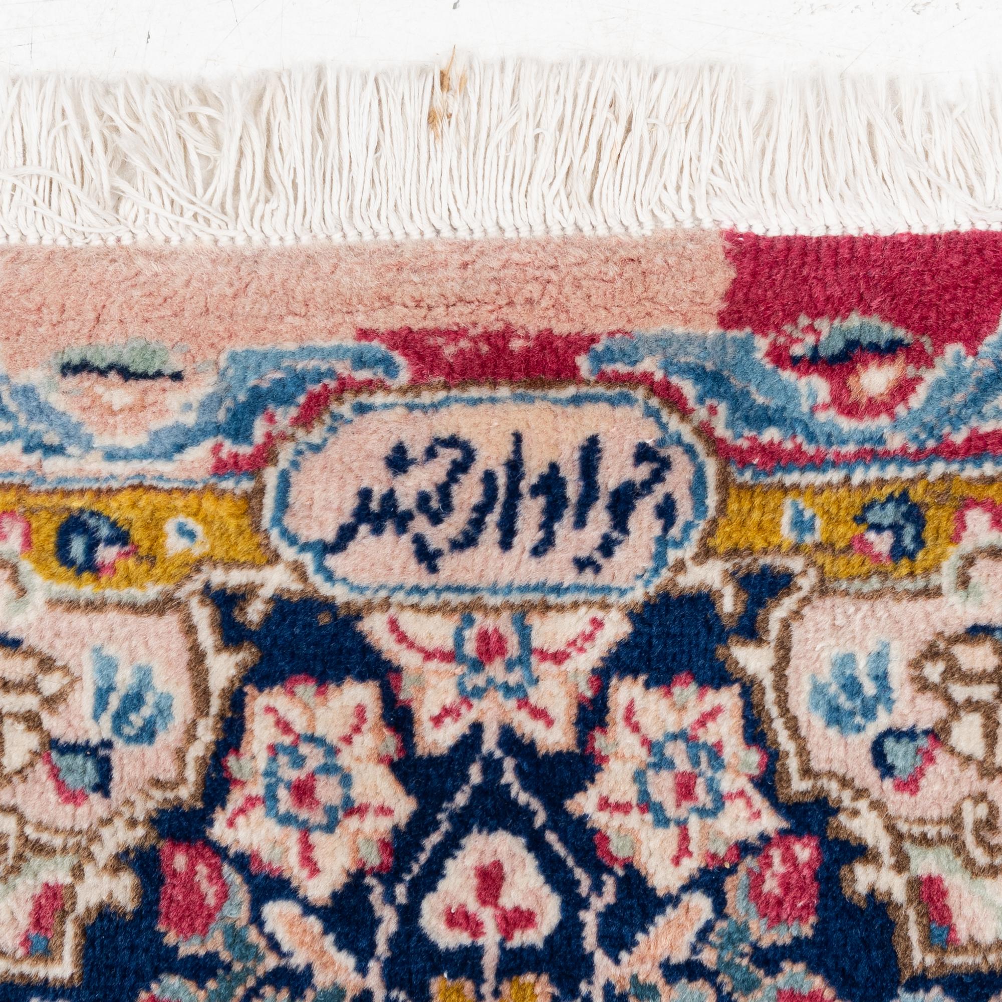 A Kirman carpet, signed, c. 388 x 279 cm.