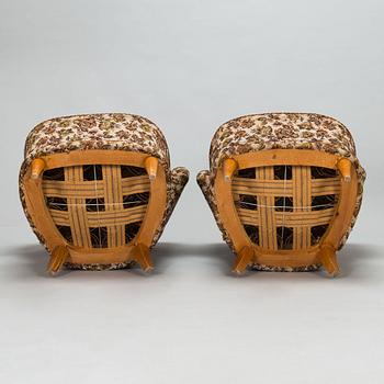 A pair of 1950's armchairs.