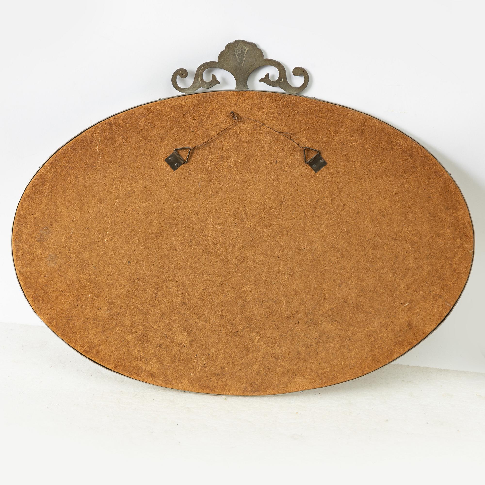 A Swedish Grace pewter mirror, 1920s/30s.