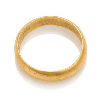 A 23K gold ring.