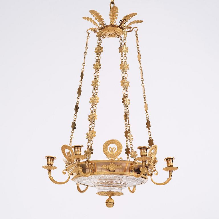 An Empire cut glass and gilded bronze six-light hanging lamp in the manner of Alexandre Guérin.