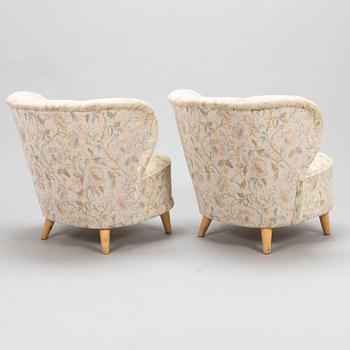 A pair of mid 20th century armchairs.
