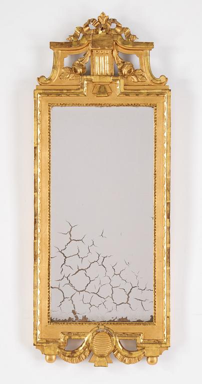 A gustavian giltwood and parcel-gilt mirror by Johan Åkerblad (master 1758-1799).
