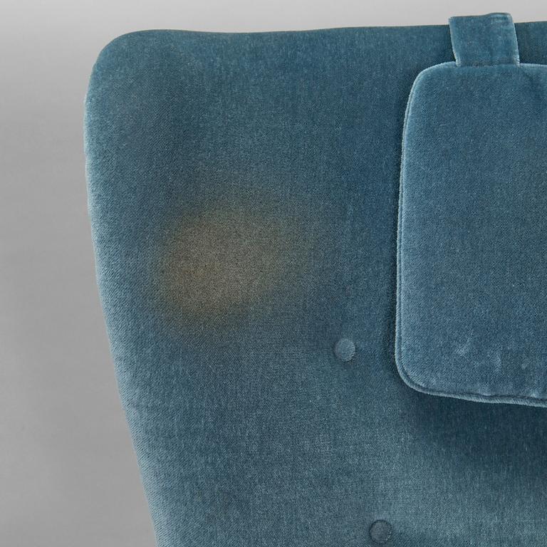 A pair of mid-20th century armchairs.