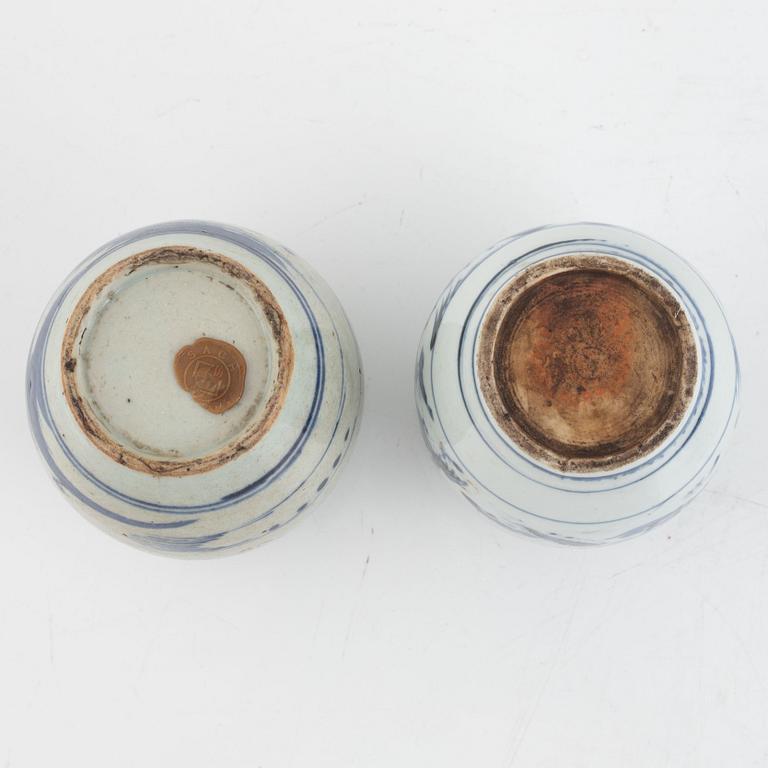 A group of two Chinese blue and white bowls and two jars, Qing dynasty, 19th century.