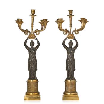 165. A pair of Fernch Empire ormolu and patinated bronze five-light candelabra, early 19th century.