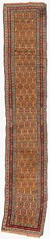 An antique Kurdish runner, c 460 x 84 cm.