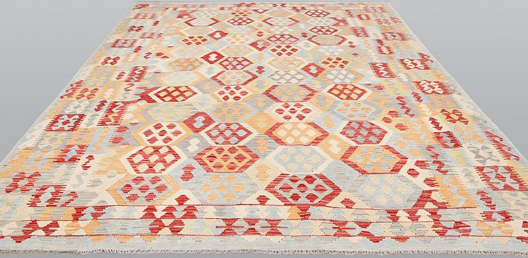 A kilim carpet, ca 340 x 259 cm.
