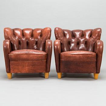 A pair of mid-20th century armchairs.