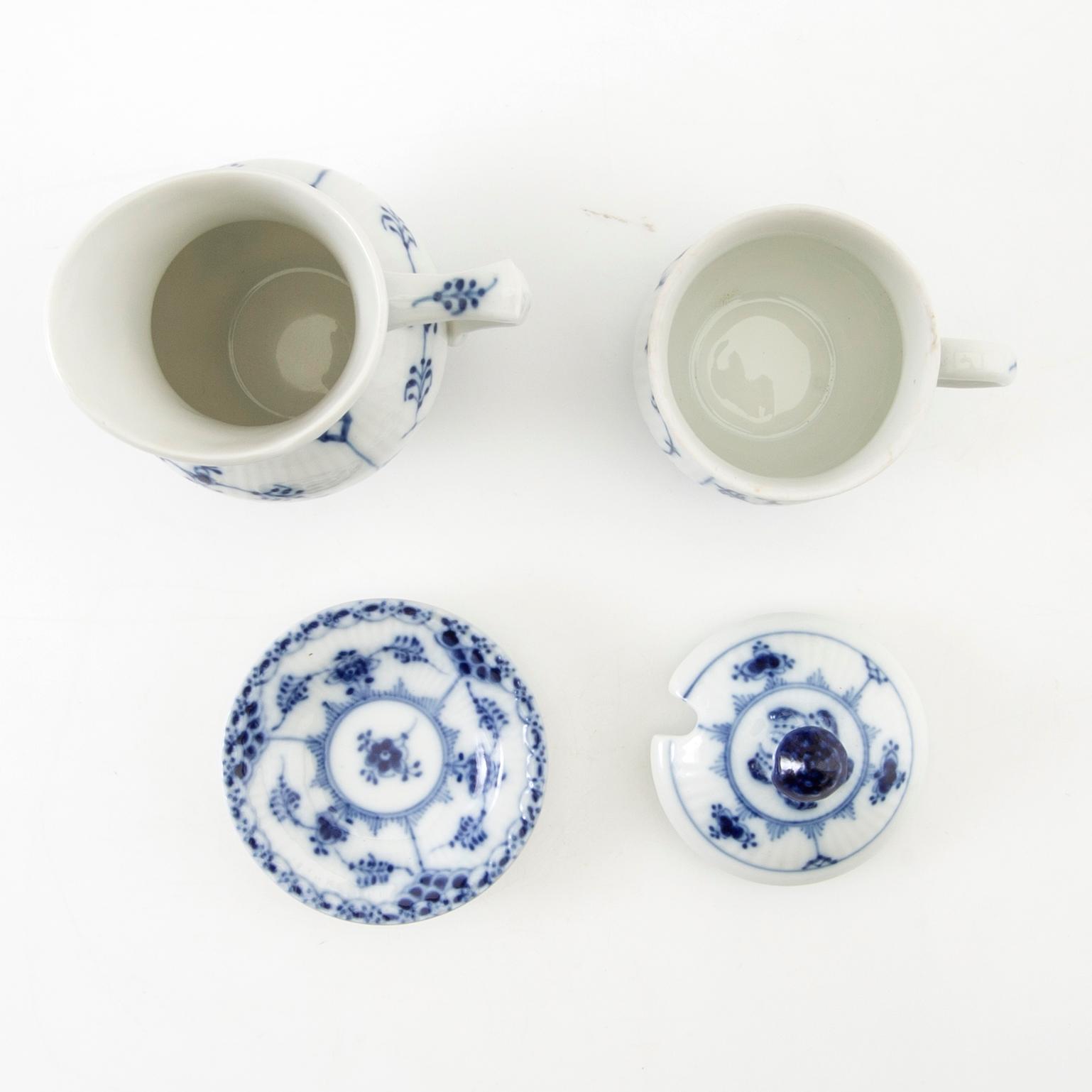 Service approximately 42 pieces "Musselmalet rifflet/halvblonde" Royal Copenhagen Denmark porcelain first half of the 20th century.