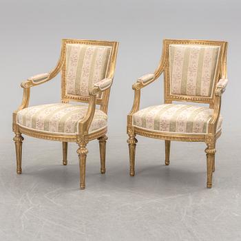 A pair of Gustavian style armchairs, first half of the 20th century.