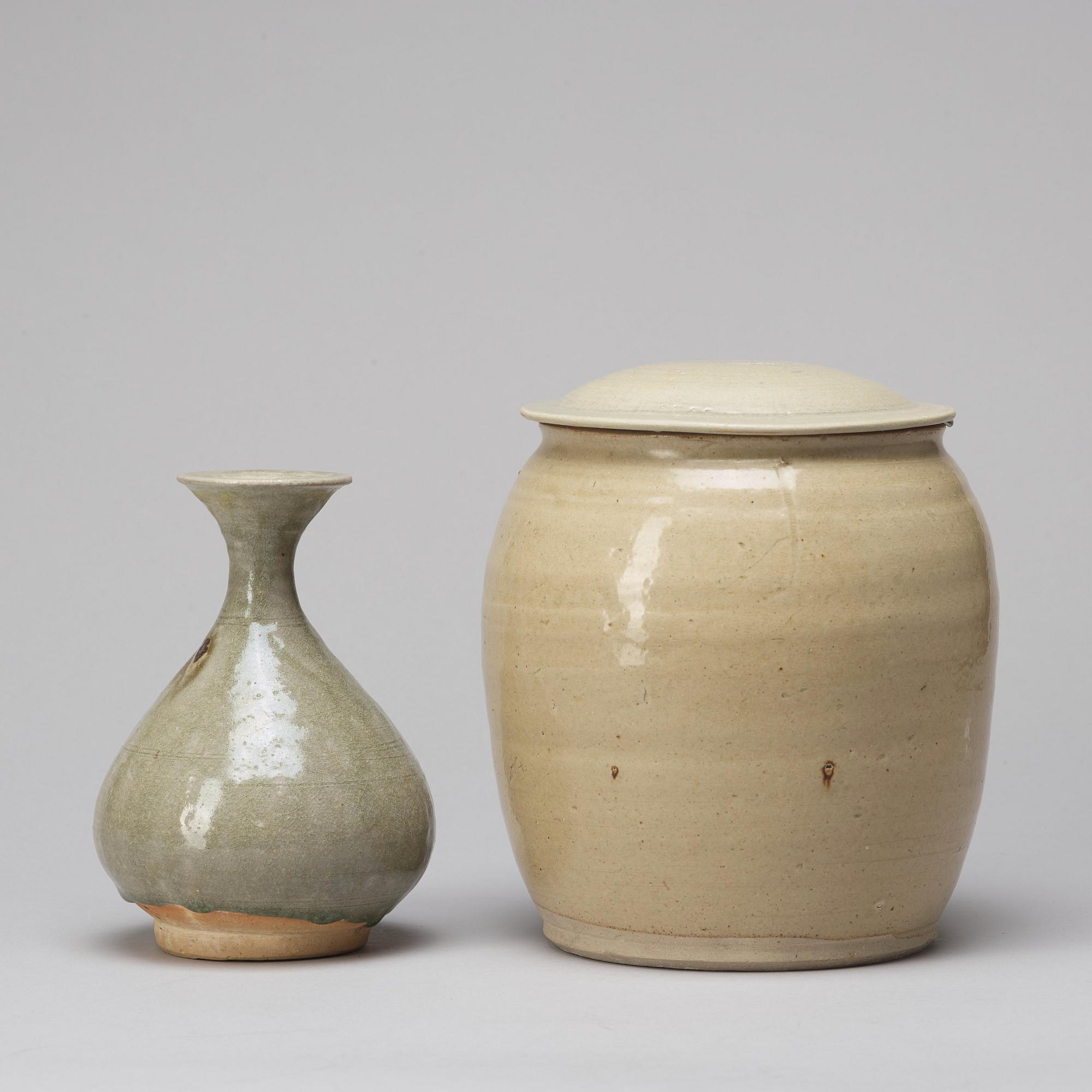 A celadon glazed jar with cover and a vase, South East Asia, 16/17th Century.