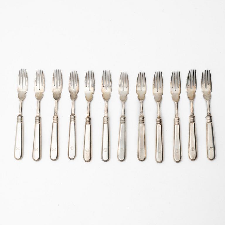 A Russian silver cutlery set, including mark of Ovchinnikov with the Imperial warrant, St Petersburg 1908-16 (24 pieces).