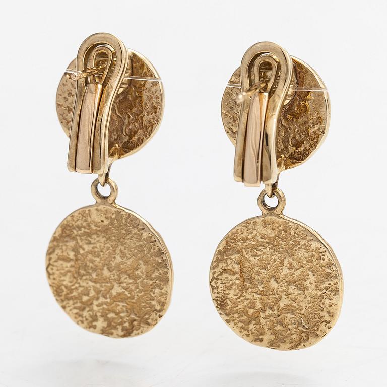 Cassandra Goad, a pair of 9K gold 'Tortilla Double' earrings. London.