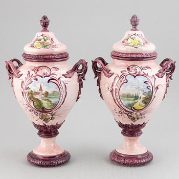 A pair of earthenware vases with covers, early 20th century.