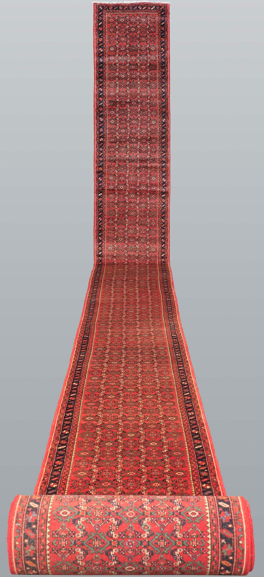 A Hosseinabad runner, approx. 1360 x 80 cm.