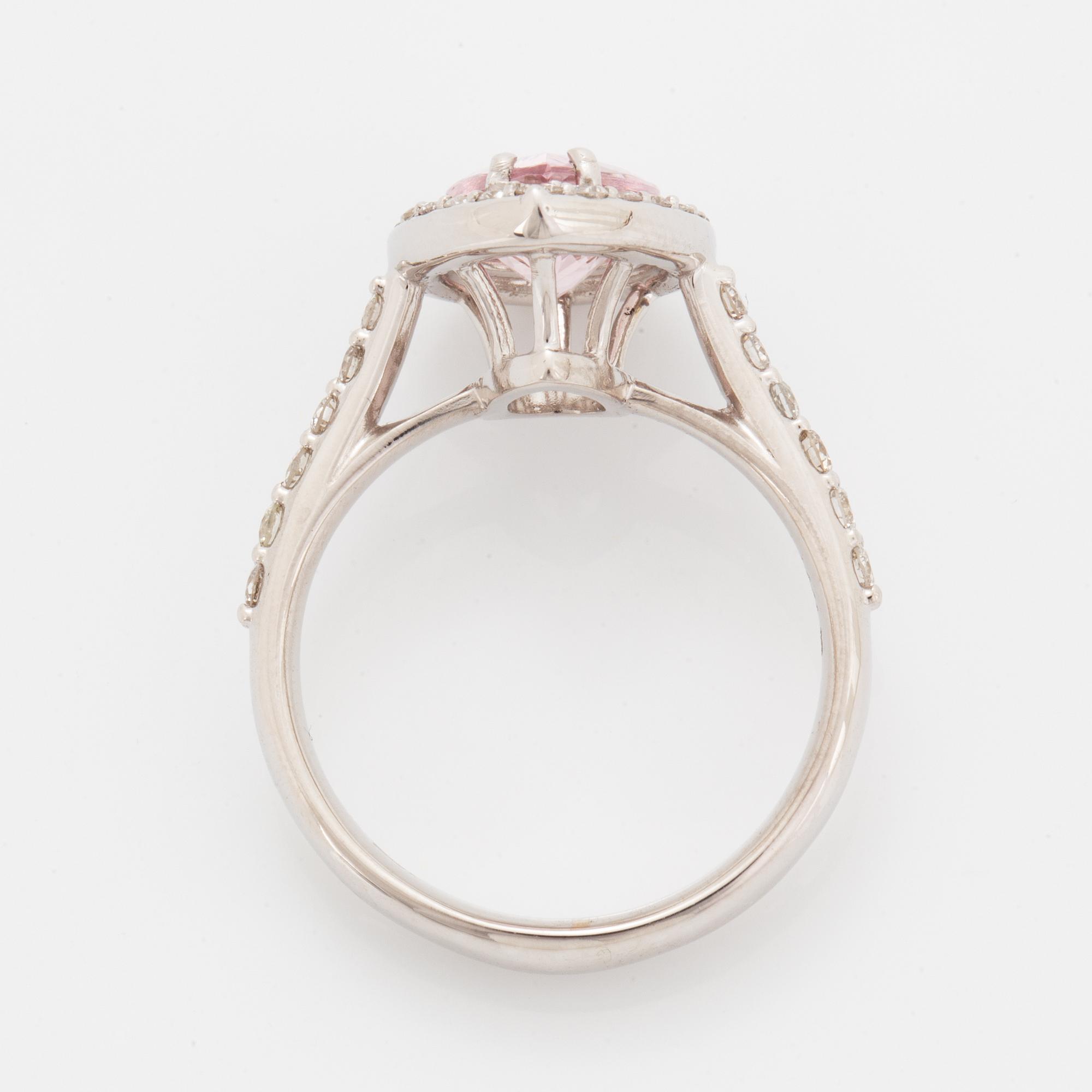 An 18K gold ring set with a faceted morganite.