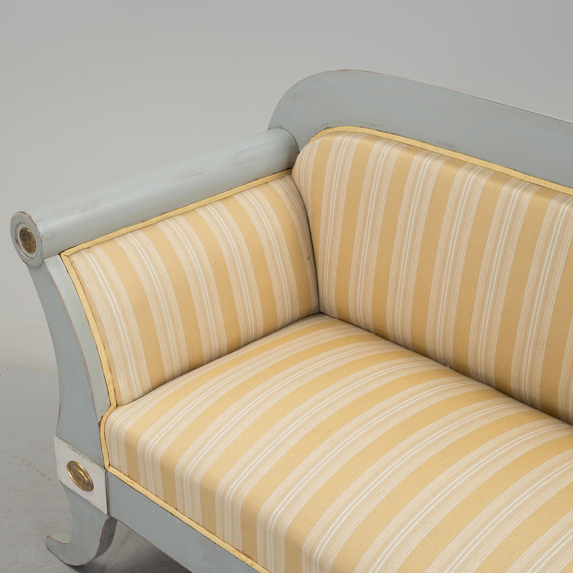 A mid 19th century painted sofa.