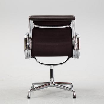 An EA 208 Soft Pad swivel chair by Charles and Ray Eames for Vitra, dated 2010.