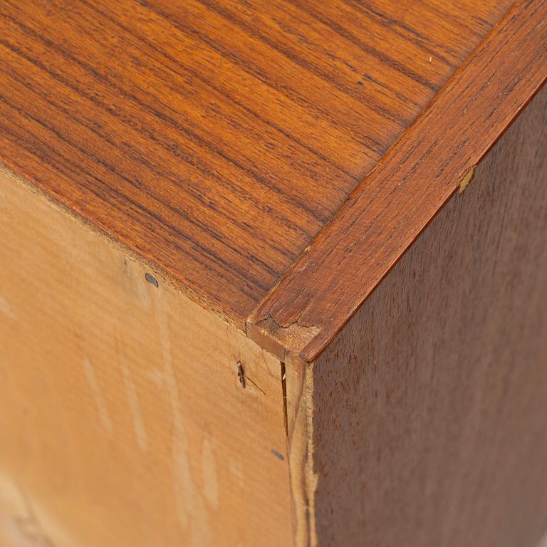 A 1950's teak veneered sideboard.