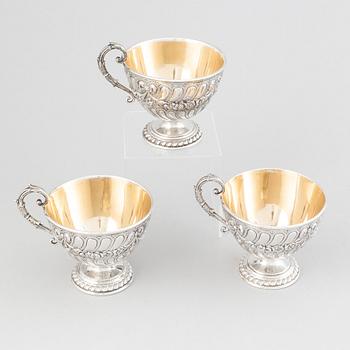 Three parcel-gilt silver chocolat-cups, mark of CG Hallberg, Stockholm 1896. Louis XVI-style.