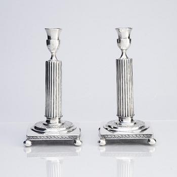 A pair of Gustavian silver candlesticks, unclear maker's mark, the cuffs with mark of Pehr Zethelius, Stockholm 1796.