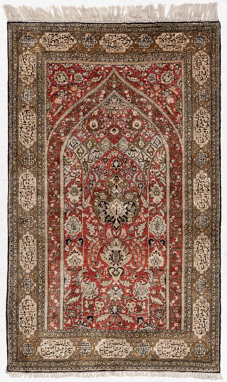 A silk Qum rug, c. 172 x 105 cm.