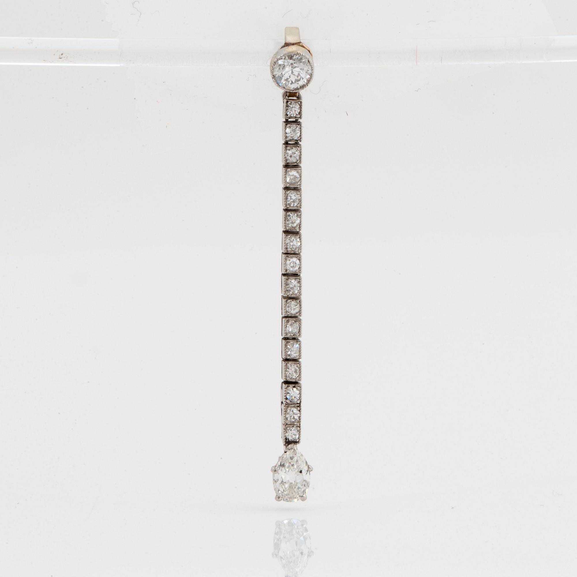 A platinum and 18K gold necklace and pendant.