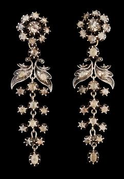 667. A pair of 19th cent, silver and diamond earrings.