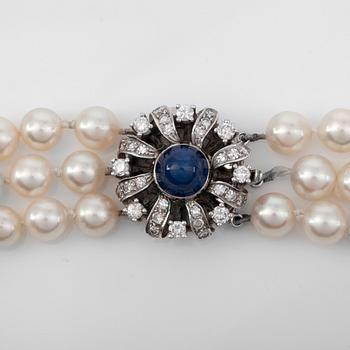 A 3-strand cultured pearl necklace. Ø ca 5.5 - 7 mm.