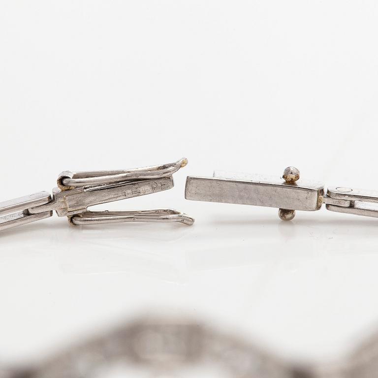 A platinum bracelet, set with brilliant- and single-cut diamonds.