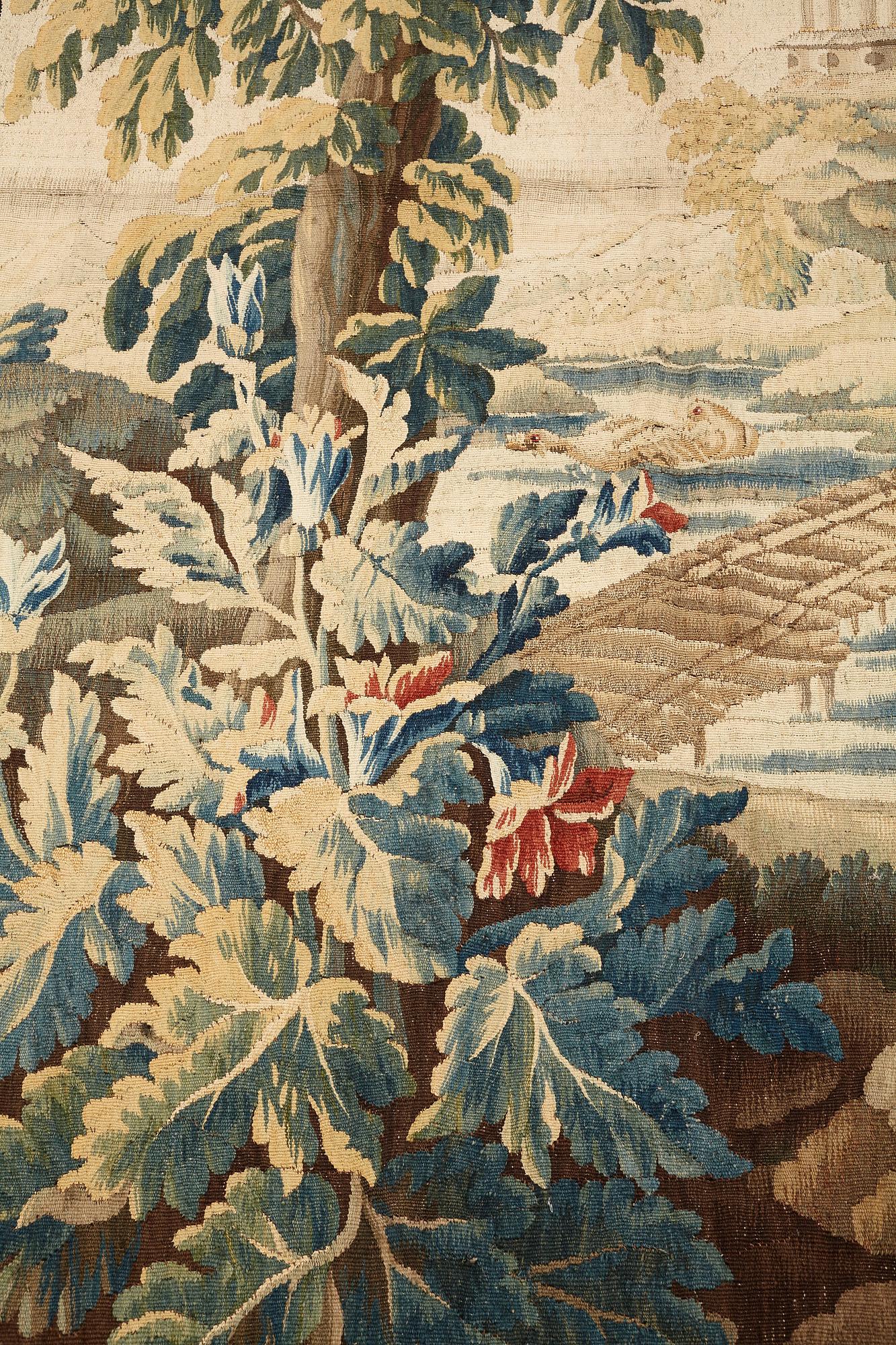 A "Verdure" tapestry, c 279 x 196 cm, signed M.R.D'AVBVSSONj.DVMONTEIL.