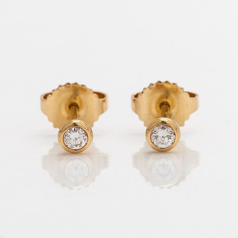 Tiffany & Co, Elsa Peretti, a pair of 18K gold 'Diamonds by The Yard' earrings with brilliant-cut diamonds.