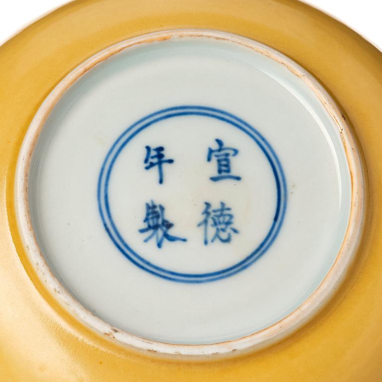 A yellow glazed cup holder, Qing dynasty with Xuandes four character mark.