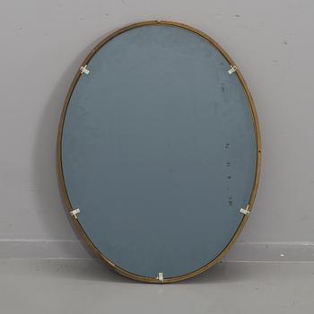 A 20th century brass mirror.