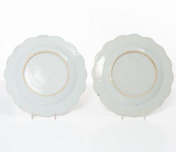 A pair of Chinese famille rose teacups with saucers and a pair of plates and two dishes, Qing dynasty, 18th century.