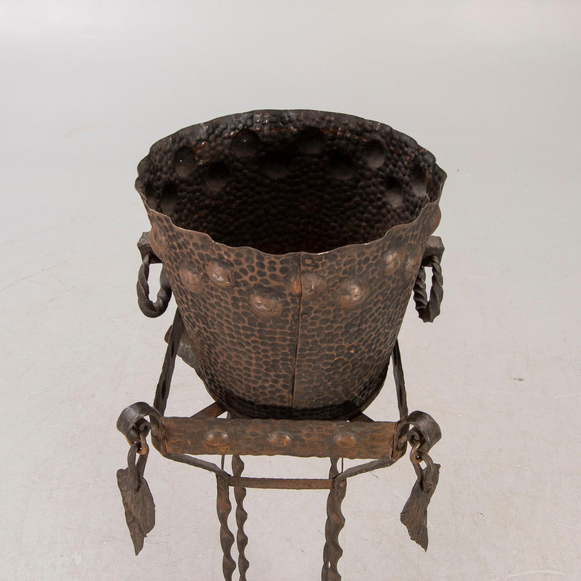 A metal pedestal and urn early 1900s.