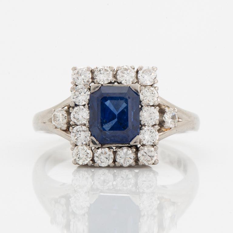 A platinum ring set with a faceted sapphire.