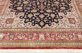 A Ghom silk carpet, approx. 340 x 239 cm.