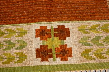 A flat weave by Berit Woelfer, signed BW, third quarter of the 20th century, 238 x 197 cm.