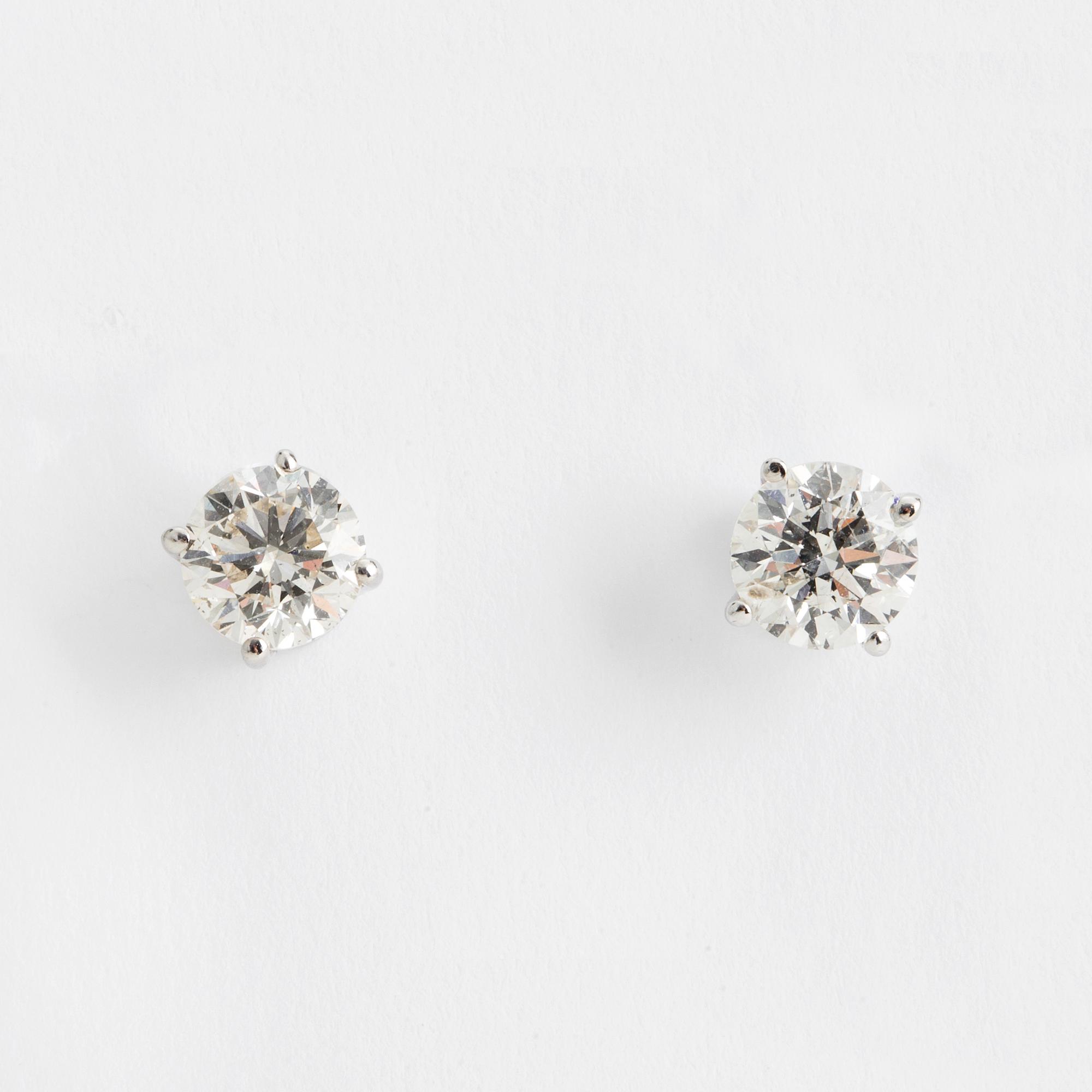 DIAMOND STUDS, 14K white gold with 2 diamonds approx. 1.40 cts.