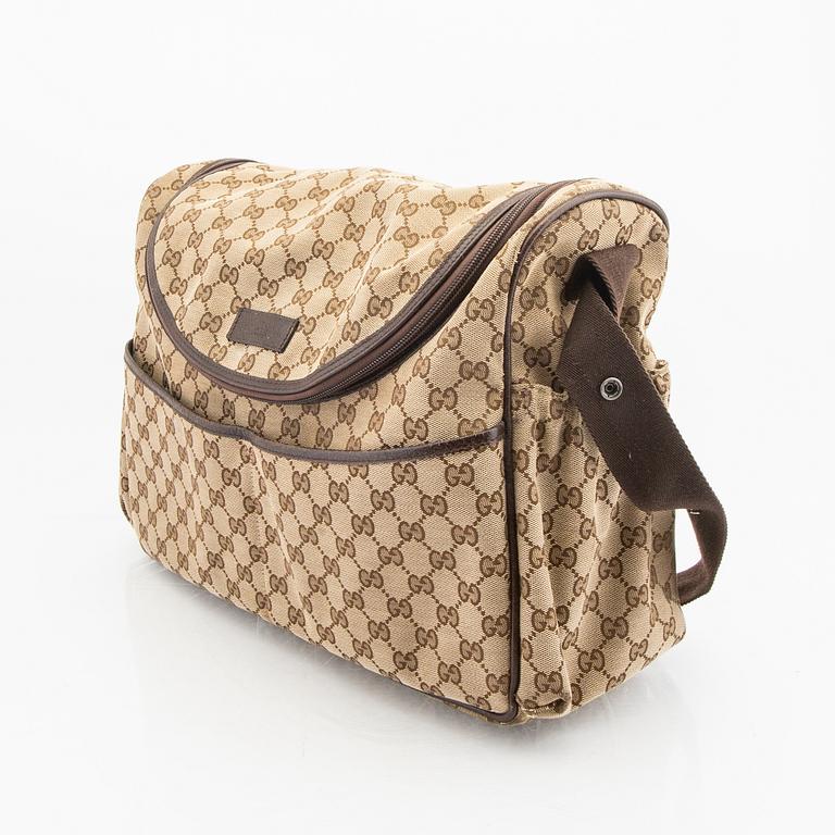 A Gucci diaper bag.