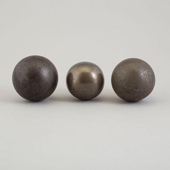 Three 19th century iron balls.