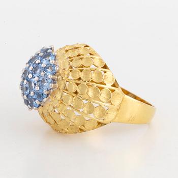 18K gold and blue topaz ring.