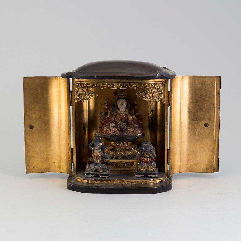 A Japanese wooden lacquered altar piece, with buddha and two deites, early 20th century.