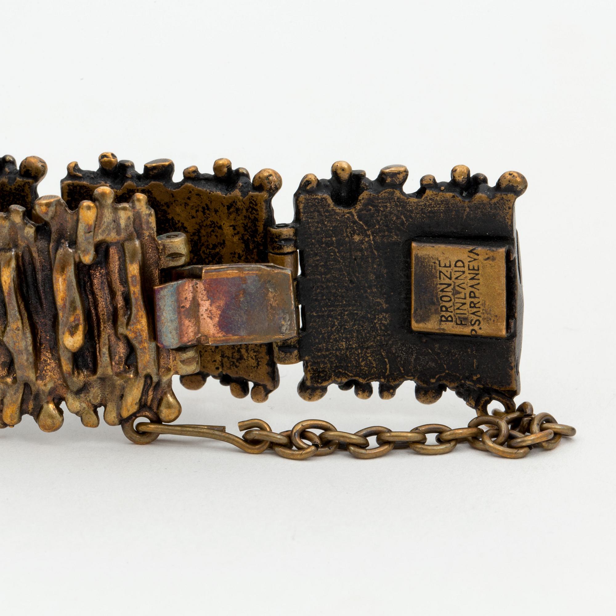 A bronze bracelet, ring and a pair of earrings by Pentti Sarpaneva, Finland.